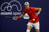 Jakub Mensik of Czech Republic returns a shot against Roberto Bautista Agut of Spain during Day 3 of the Miami Open - Source: Getty